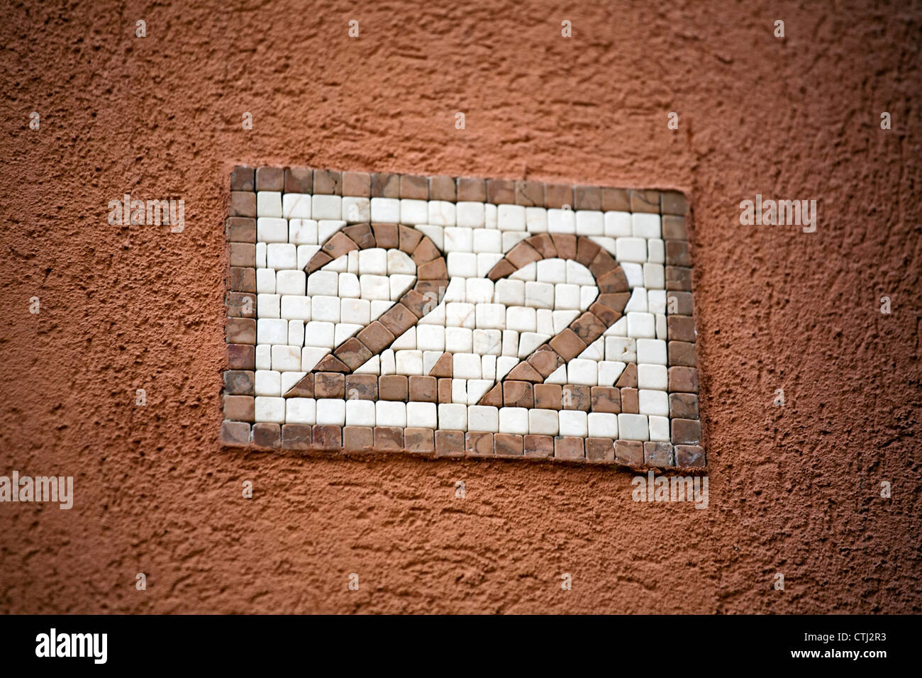 door number made from stone mosaic pieces Stock Photo Alamy