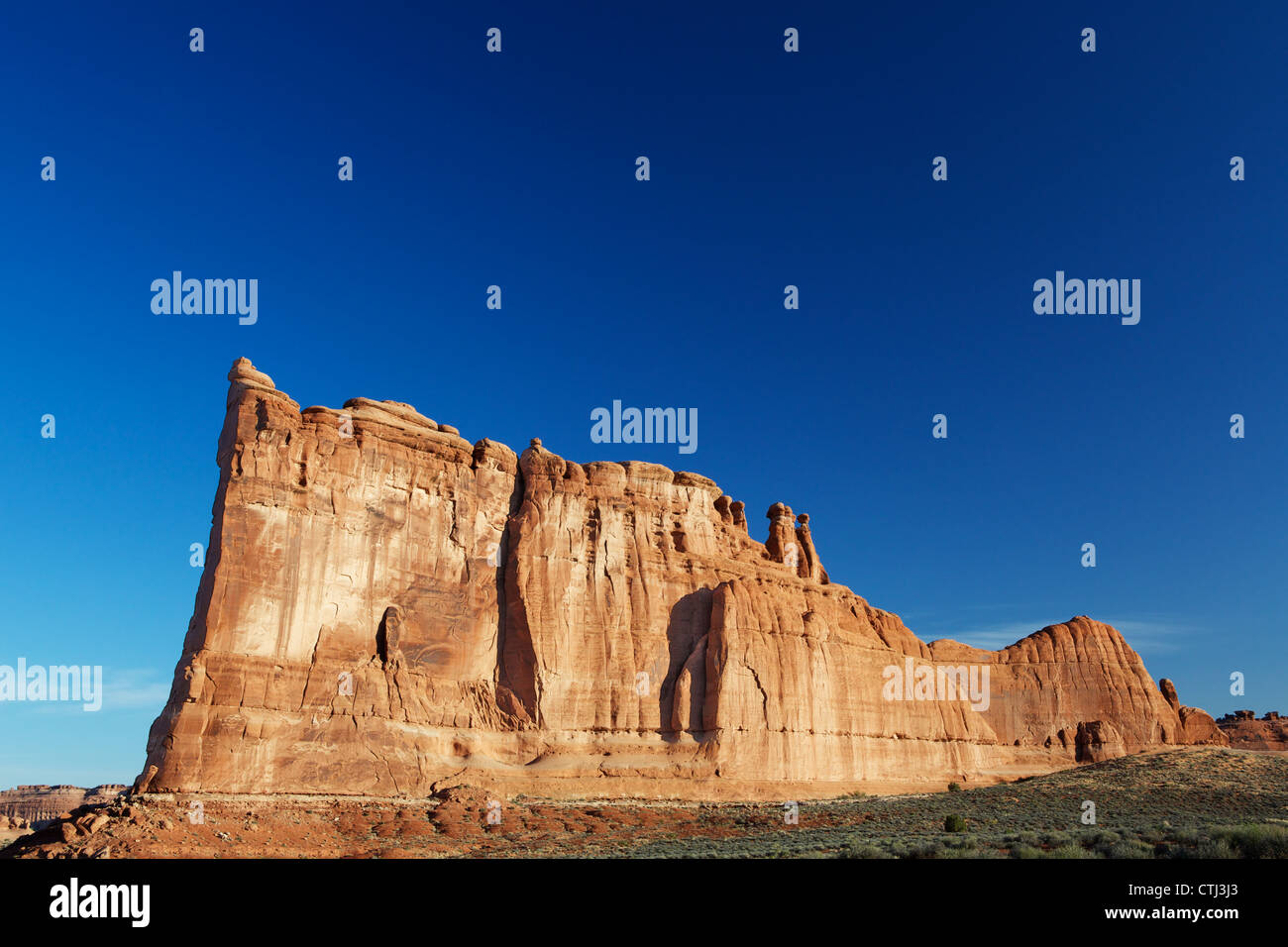 Courthouse Towers Ridge in Arches National Park with dramatic Blue Sky Stock Photo