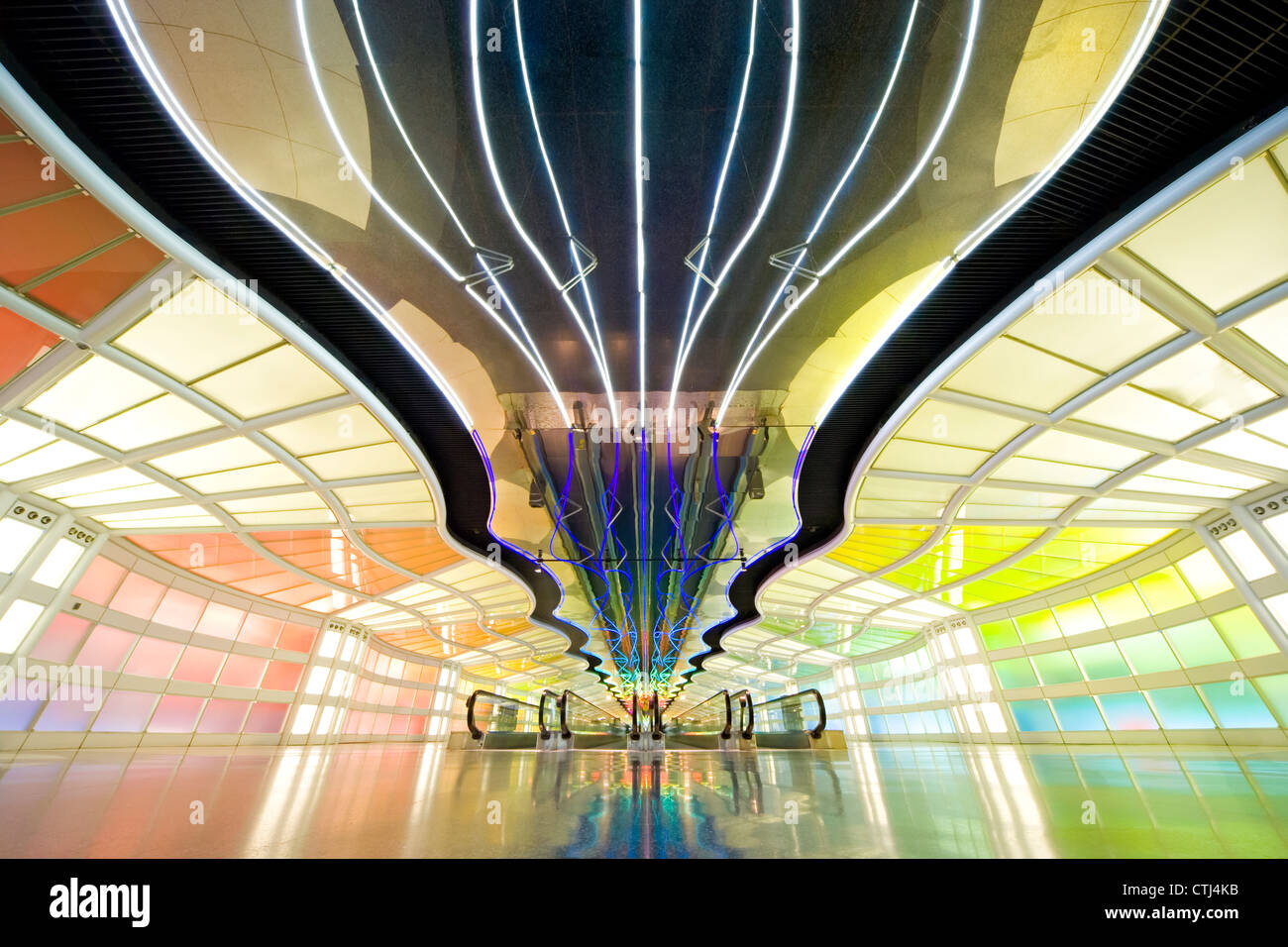 Chicago O'Hare International Airport. Tunnel between Concourses B and C of United Terminal with moving neon lights. Stock Photo