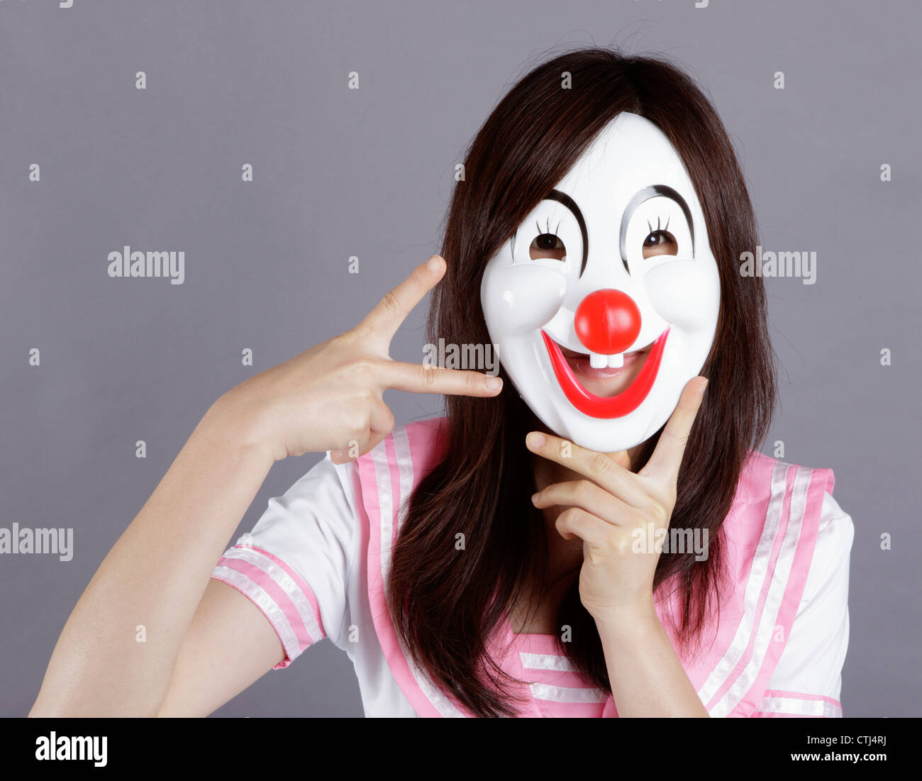 School girl wears clown mask Stock Photo Alamy