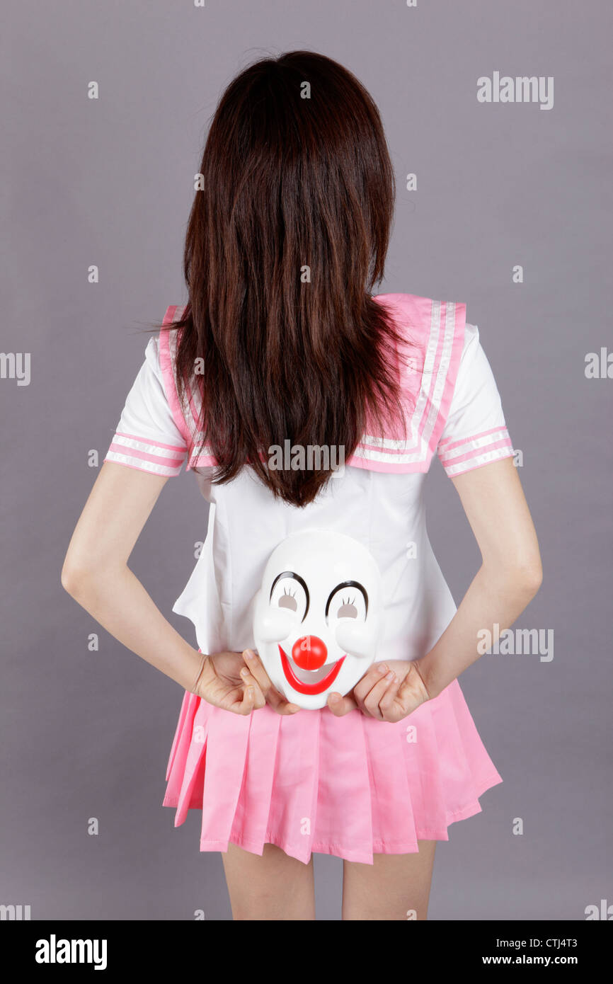 School girl wears clown mask Stock Photo Alamy