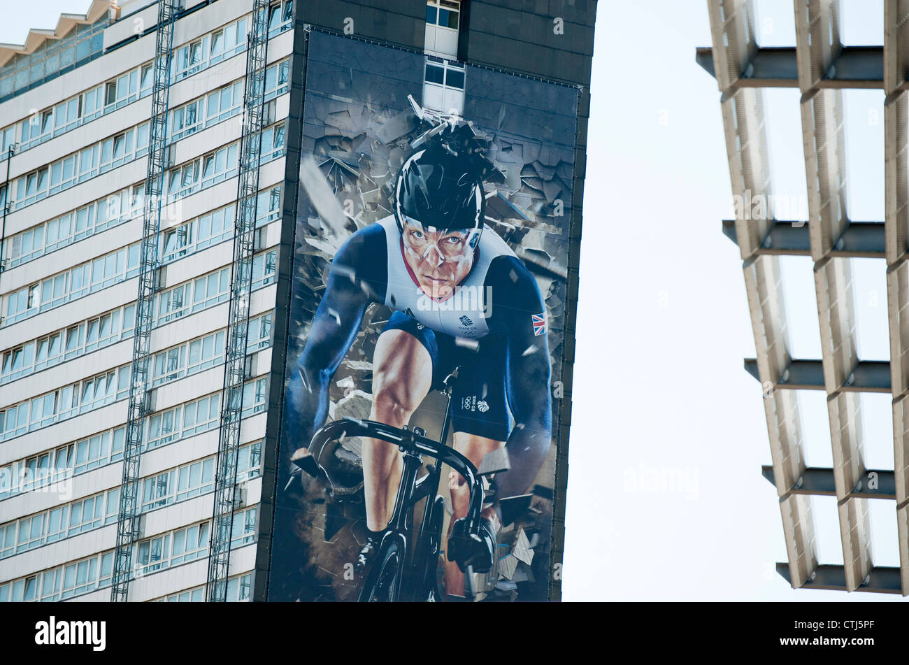 Giant mural of UK cyclist, Sir Chris Hoy covers the side of a block of flats in Stratford near the London 2012 Olympic park. Stock Photo