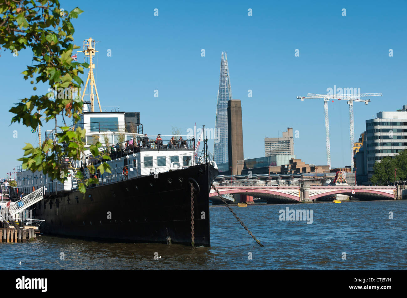 The Shard and Tate Britain with HMS President moored in the Thames near the Embankment station, London, England Stock Photo