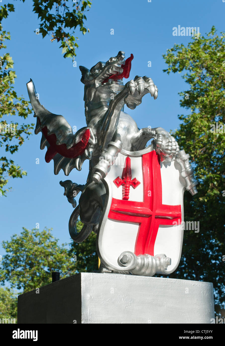 Dragon representing part of the armorial bearings of the Corporation of the City of London marks the boundary of the city. Stock Photo