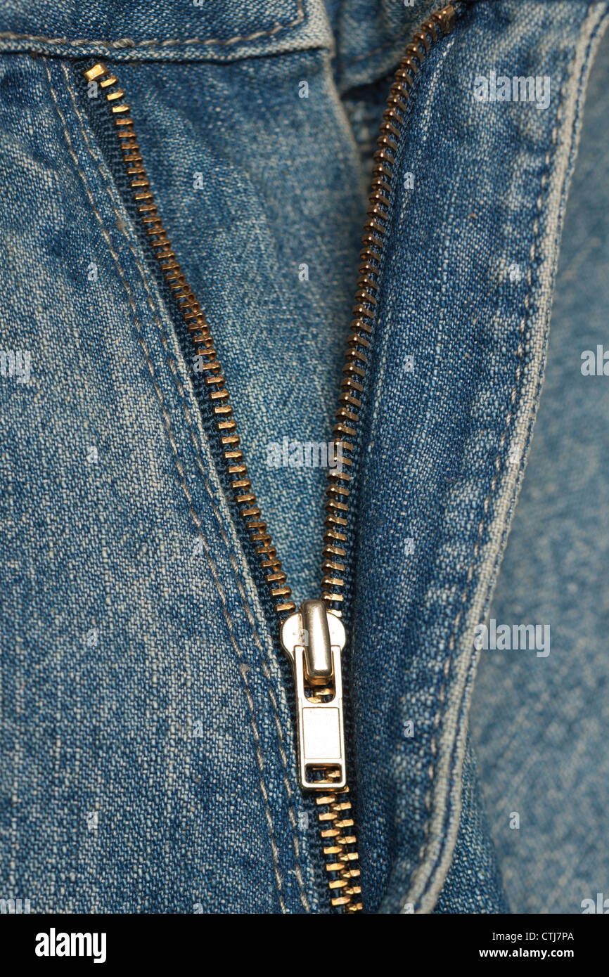 Zip on a pair of denim jeans Stock Photo