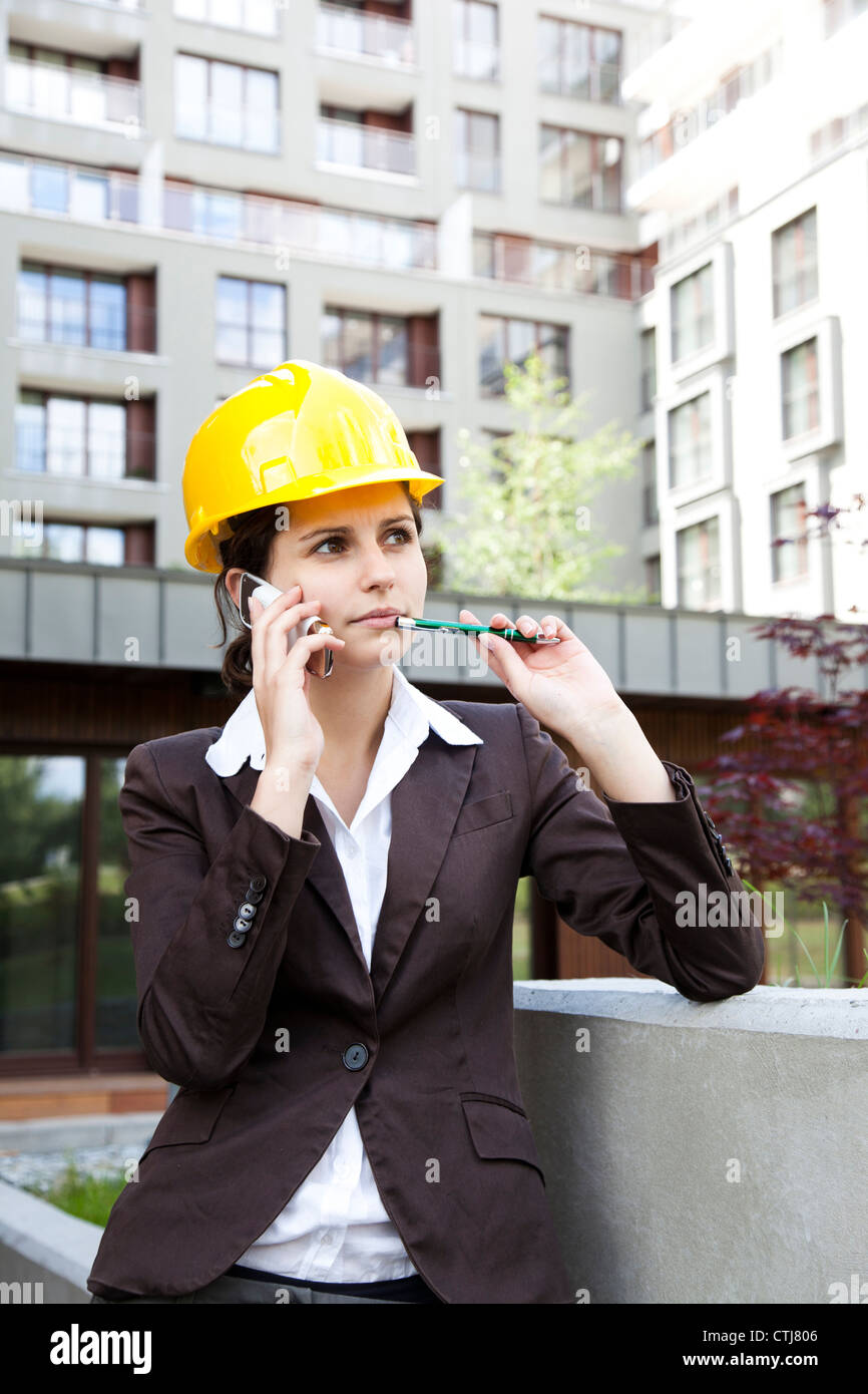 Engineer Calling Female construction engineer calling Stock Photo - Alamy