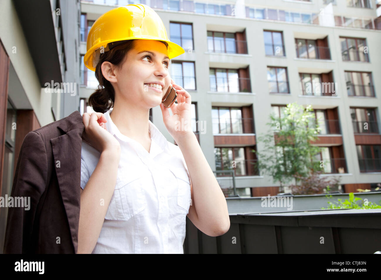Engineer Calling Female construction engineer calling Stock Photo - Alamy