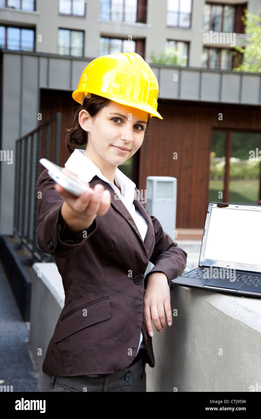 Female construction engineer calling Stock Photo - Alamy