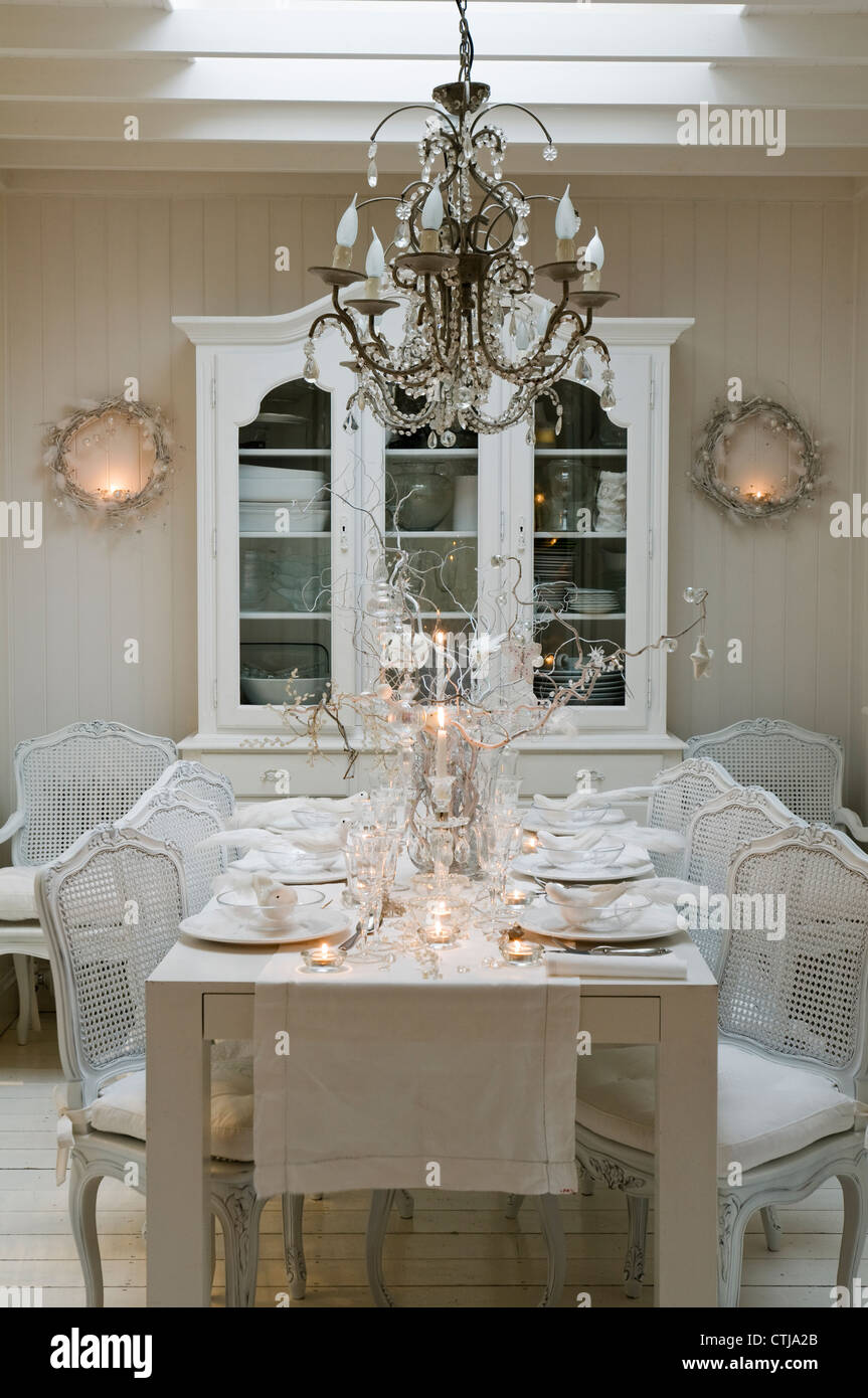 Dining room with skylight and Bordeaux glass fronted dresser Stock