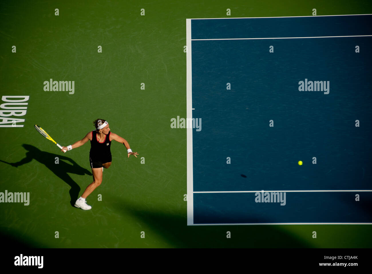 Svetlana Kuznetsova returns a serve at the Dubai Tennis Championships, 2010 Stock Photo