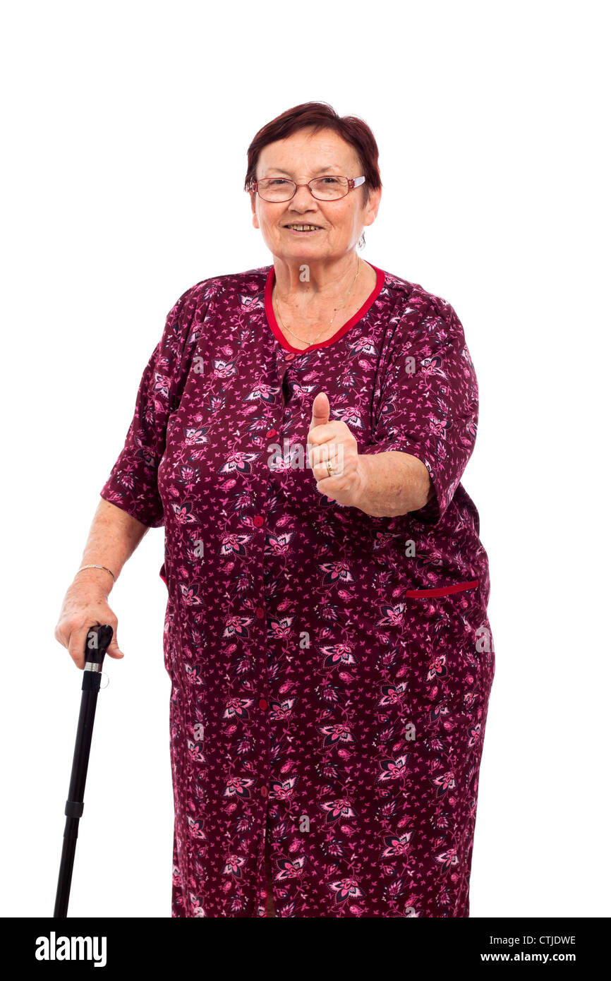 Portrait of happy smiling senior woman with thumb up, isolated on white background. Stock Photo