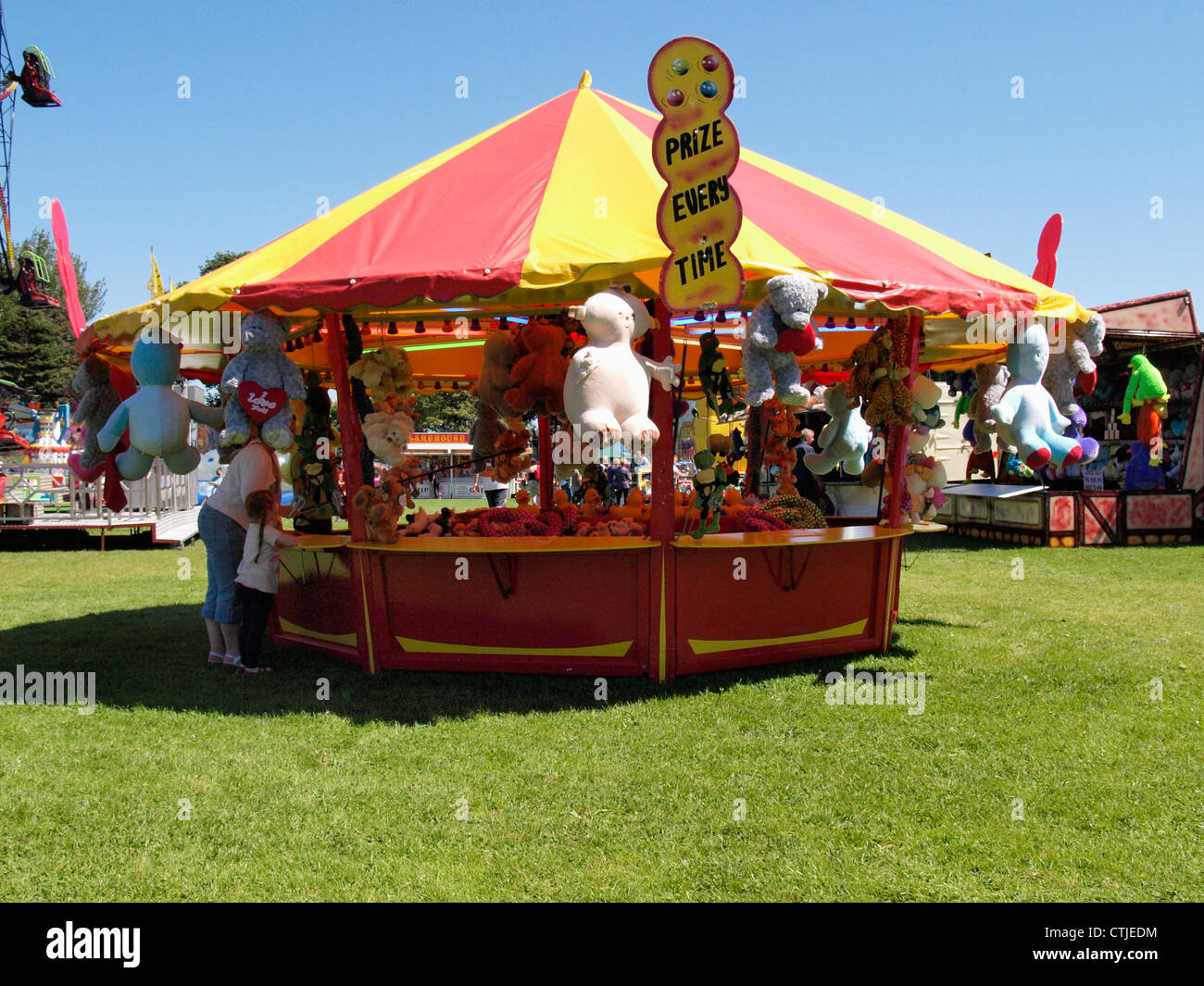 Hook a Duck stall at a fairground, UK Stock Photo Alamy