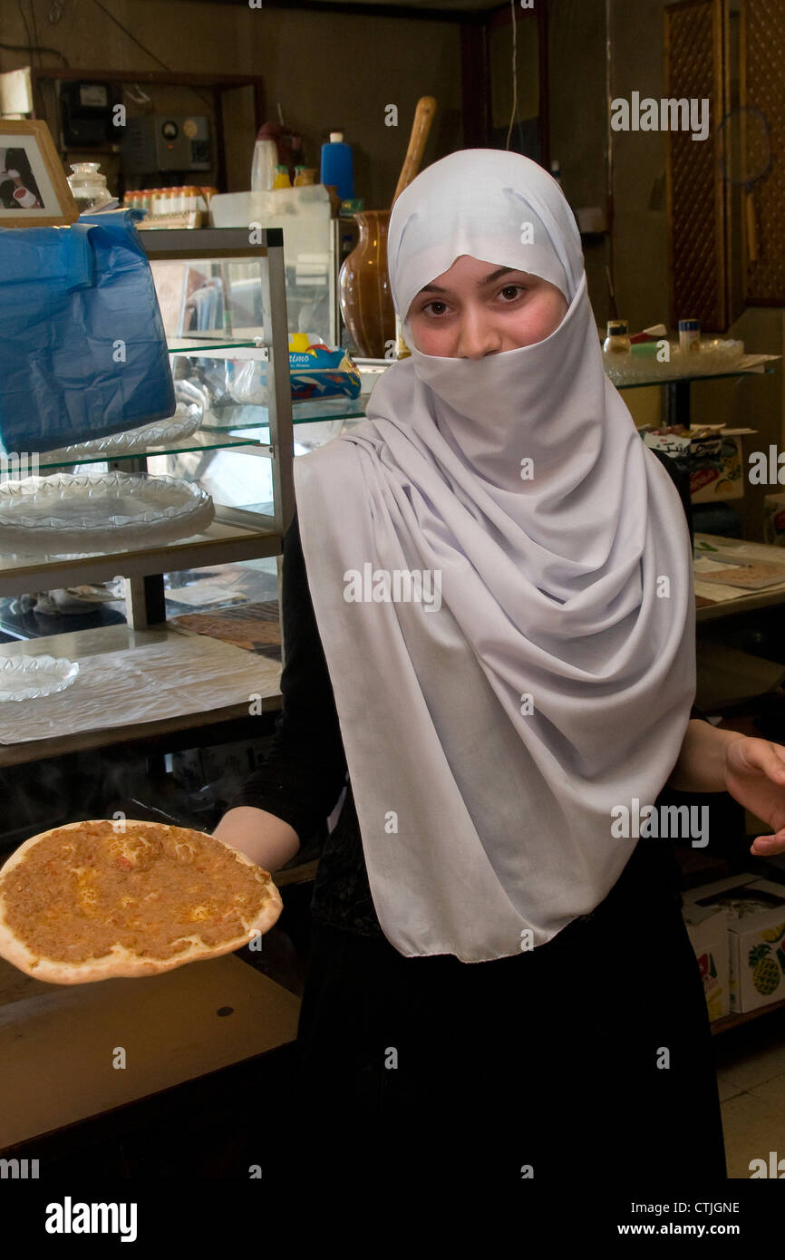Sara preparing manaeesh in bakery of Nabil Kamal Eldin in Batloun, Shouf Mountains in Lebanon,. Stock Photo