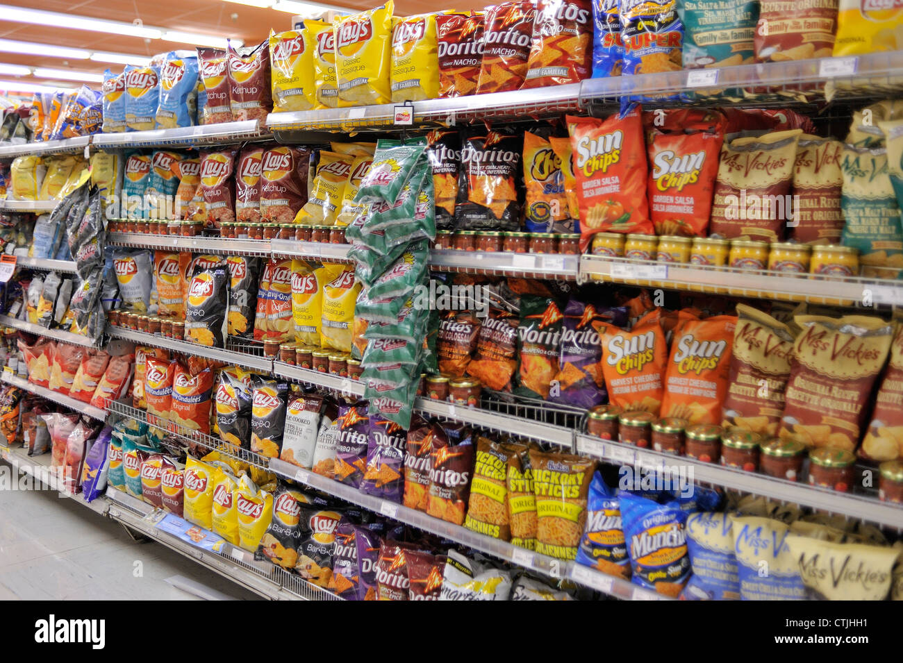 A display of potato chips is photographed in a grocery store, at Montreal on July 23, 2012. Stock Photo