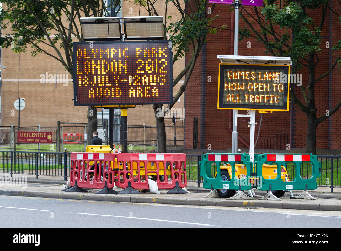 Electronic road signs in Stratford indicating to avoid the Olympic Park area during London 2012 when the Games Zil lanes open. Stock Photo