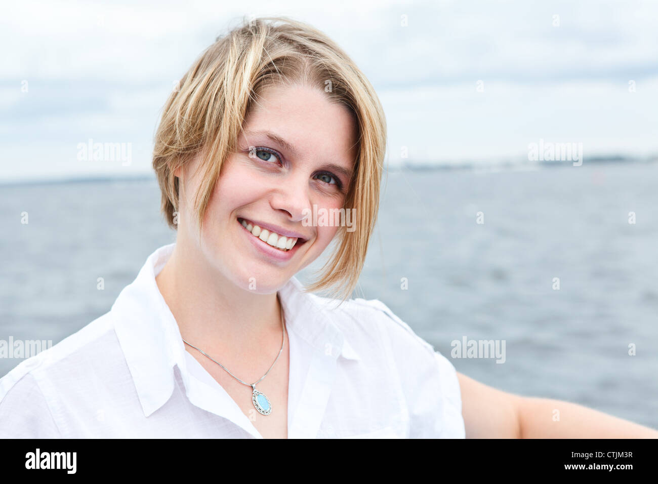 Happy smiling woman portrait looking at camera Stock Photo - Alamy