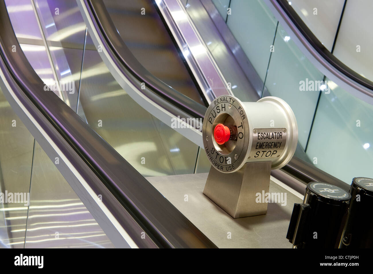 Emergency stop button on escalators in a London railway station, England. Stock Photo