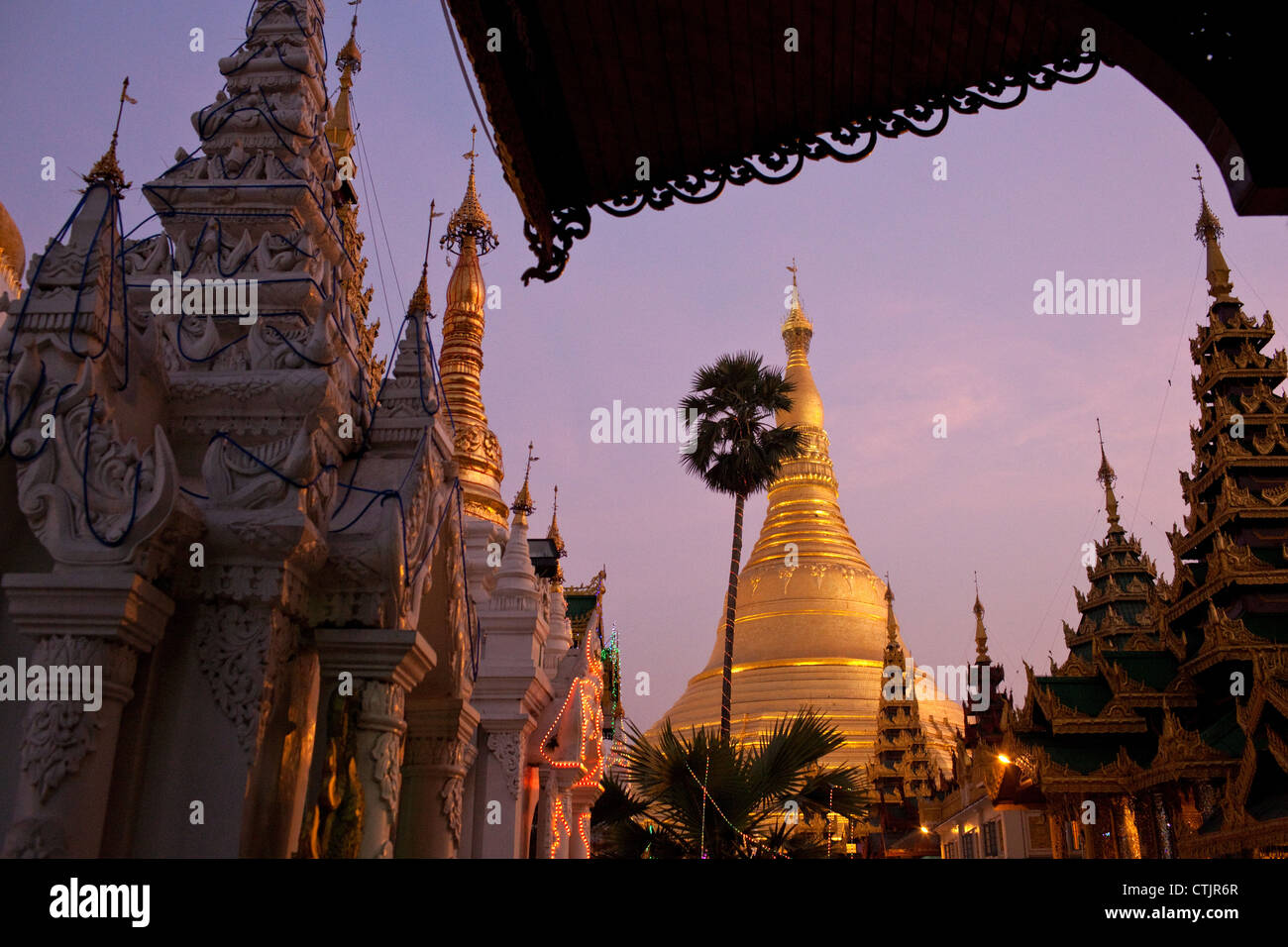 The golden stupa of Shwedagon Pagoda at sunset  in Yangon (Rangoon), Myanmar (Burma) Stock Photo