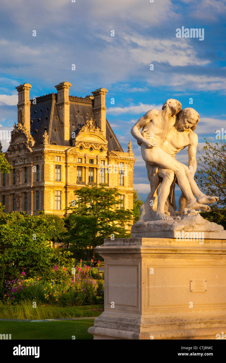 Good Samaritan Statue in Jardin des Tuileries with Pavillon de Flore of the Musee du Louvre beyond, Paris, France Stock Photo