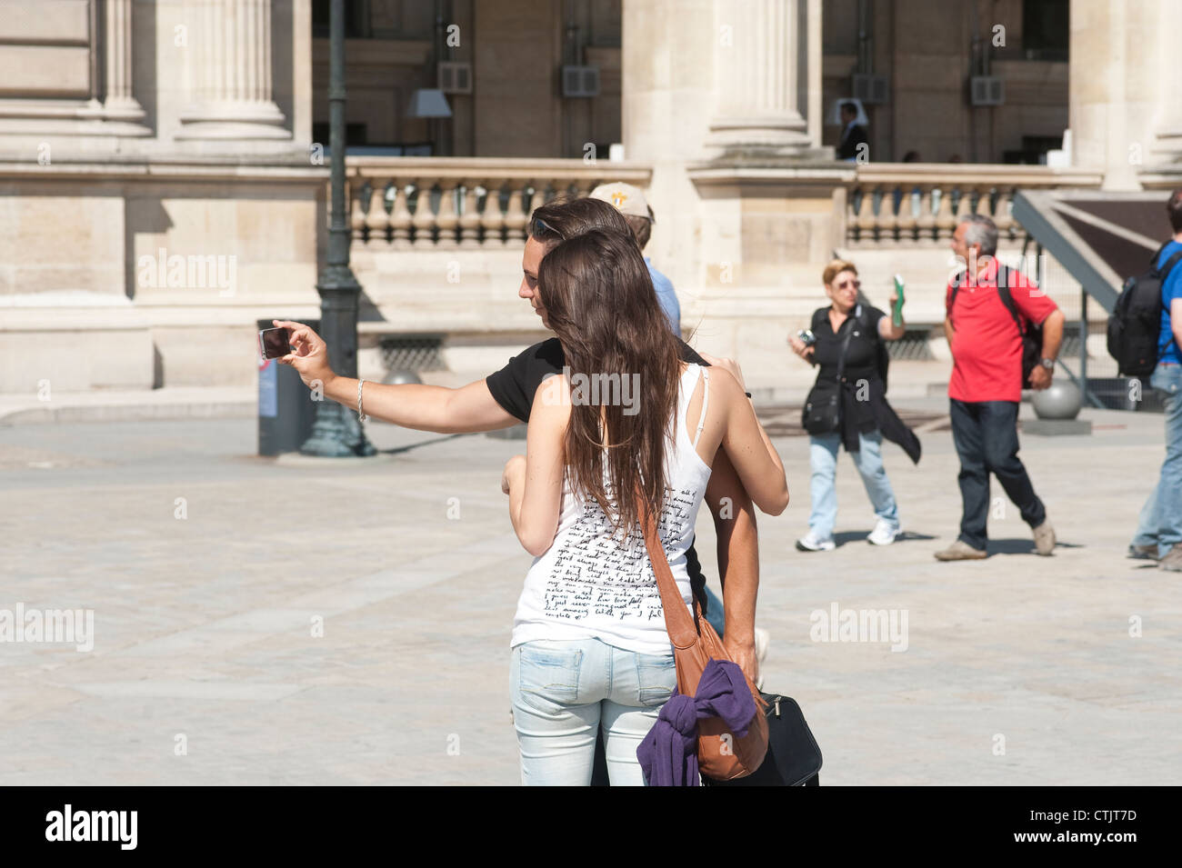 Paris, France - Young tourist couple taking photo of themselves Stock Photo