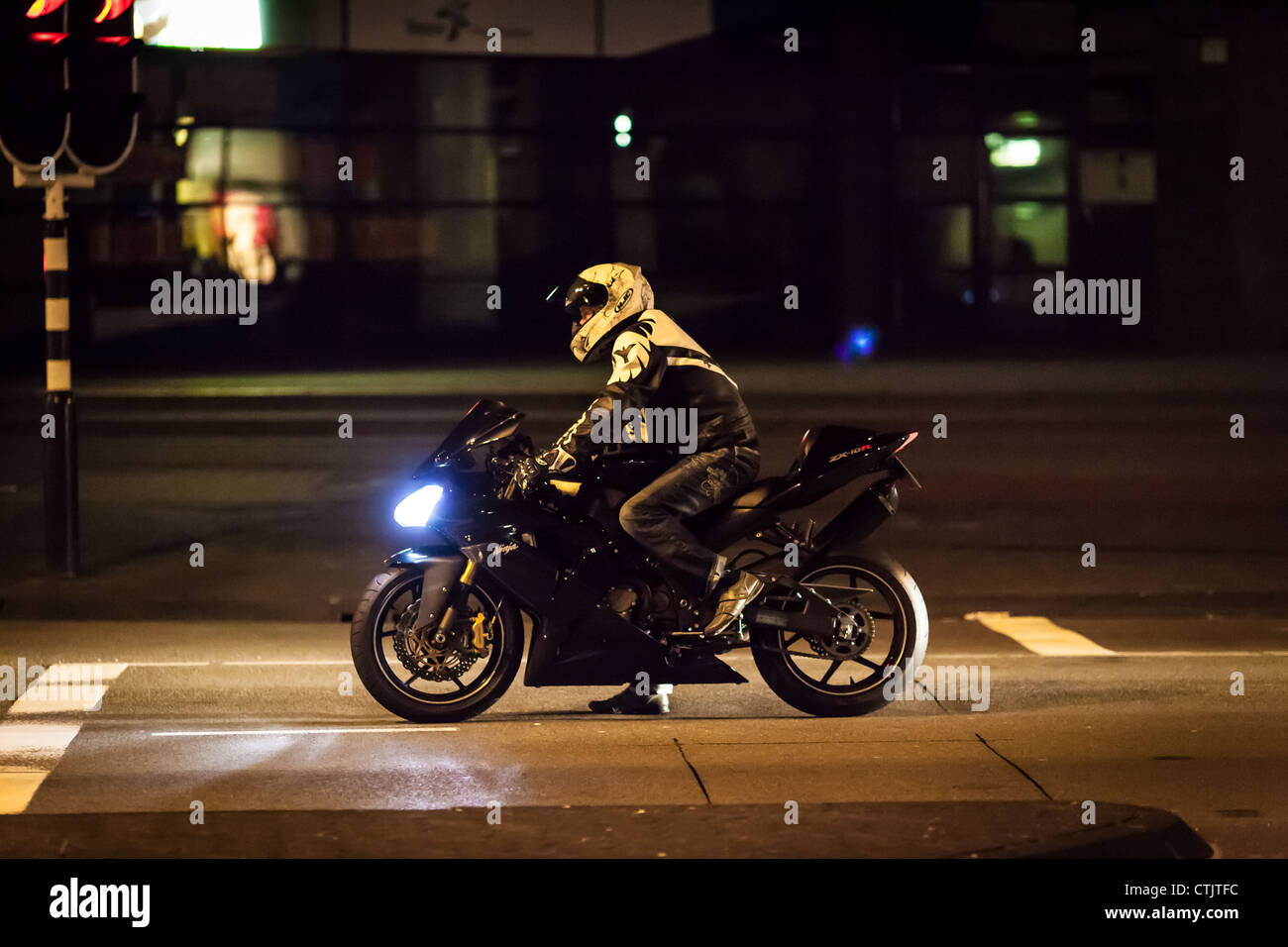 front of stoplight at night Stock Photo 