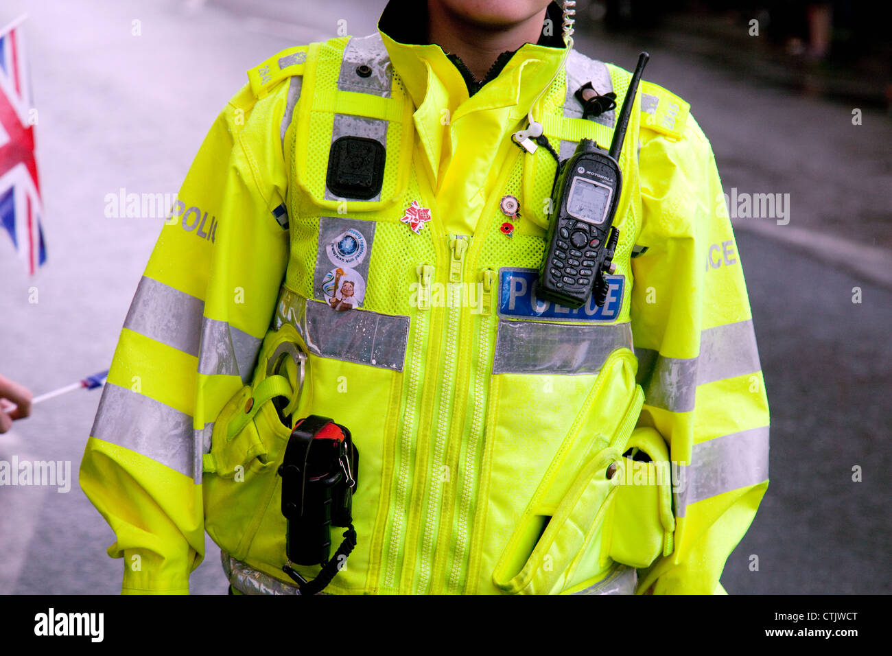 Police UK; Policewoman in a fluorescent uniform, showing close up of police equipment, Suffolk England UK Stock Photo