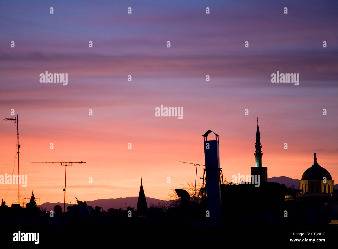 Damascus rooftops sunset sky Stock Photo