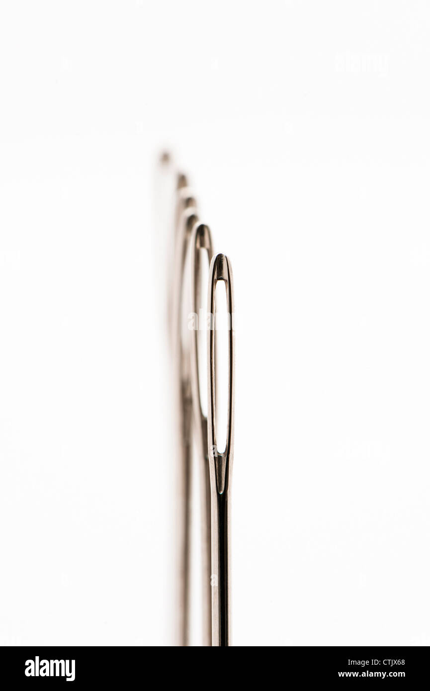 Abstract view of a row of sewing needles Stock Photo