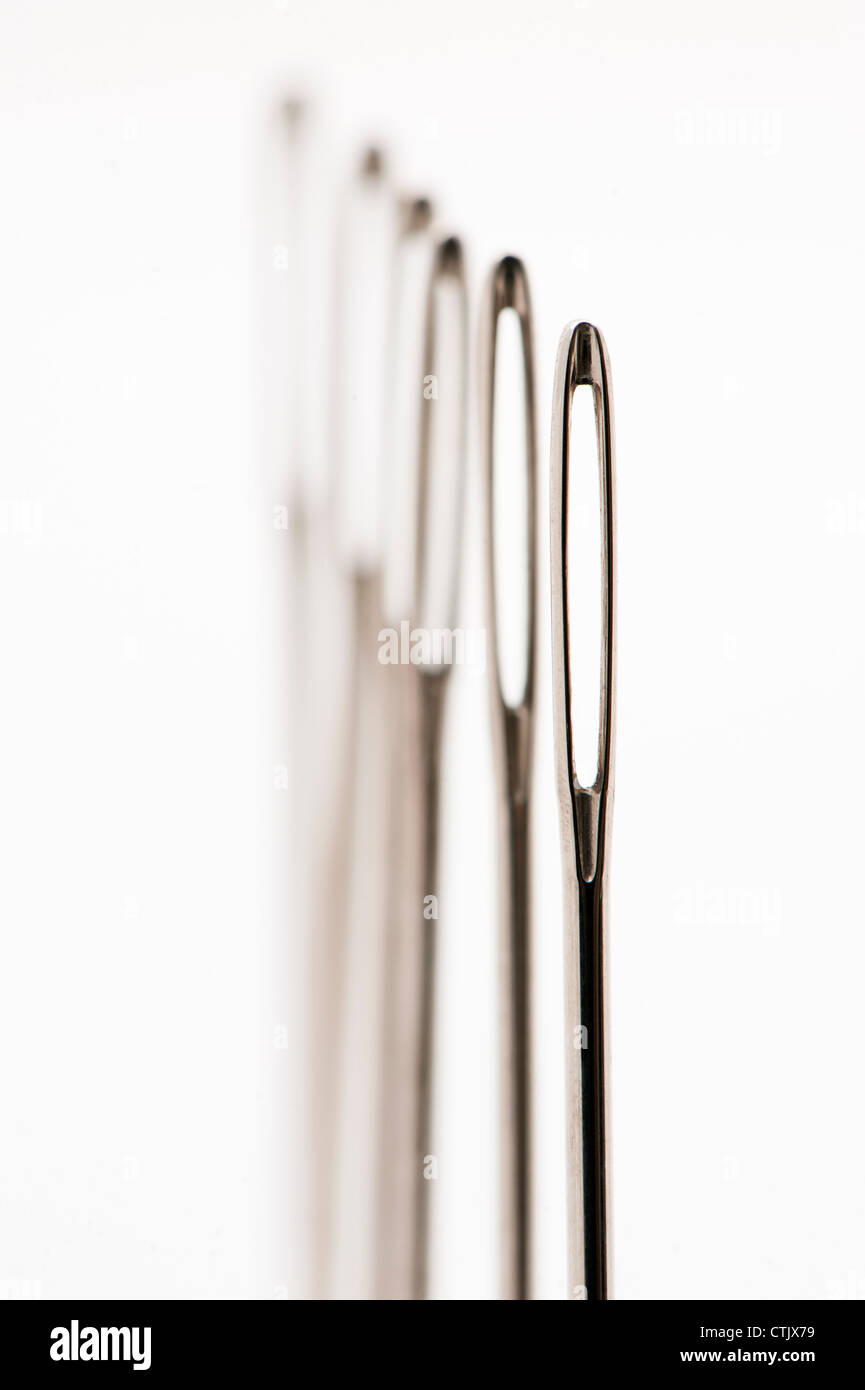 Abstract view of a row of sewing needles Stock Photo