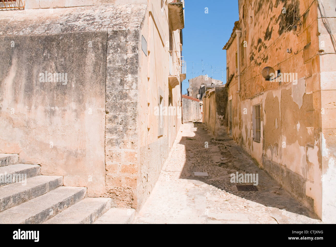 narrow street in baroque style town - Noto, Sicily Stock Photo