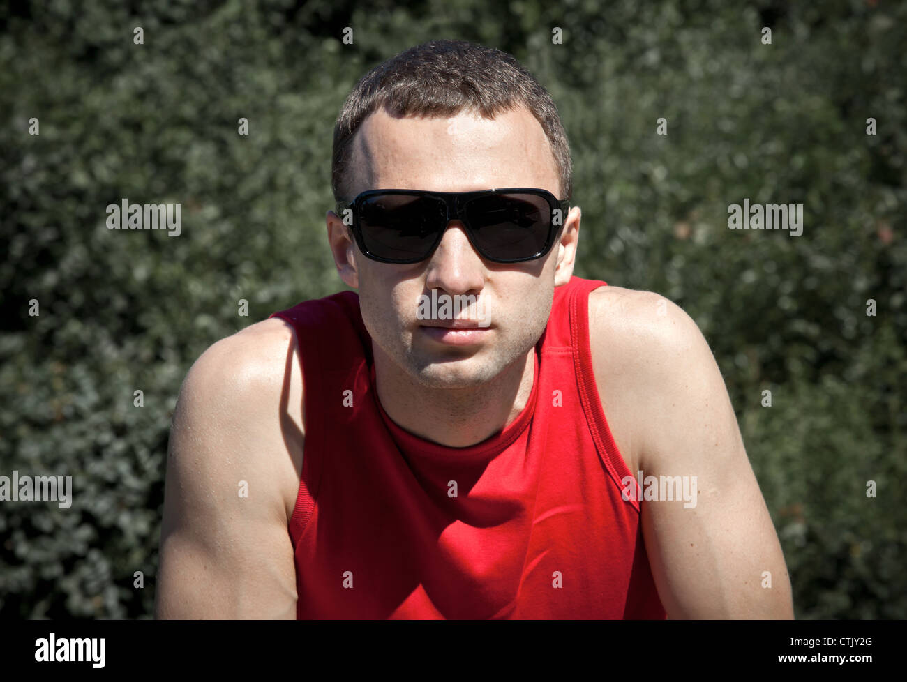 Closeup outdoor portrait of young man in black sunglasses Stock Photo