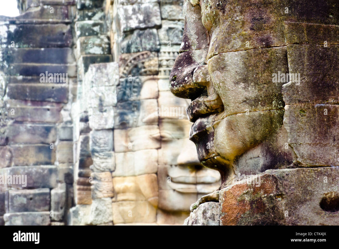 Two stone statue faces at Bayon, Cambodia Stock Photo Alamy
