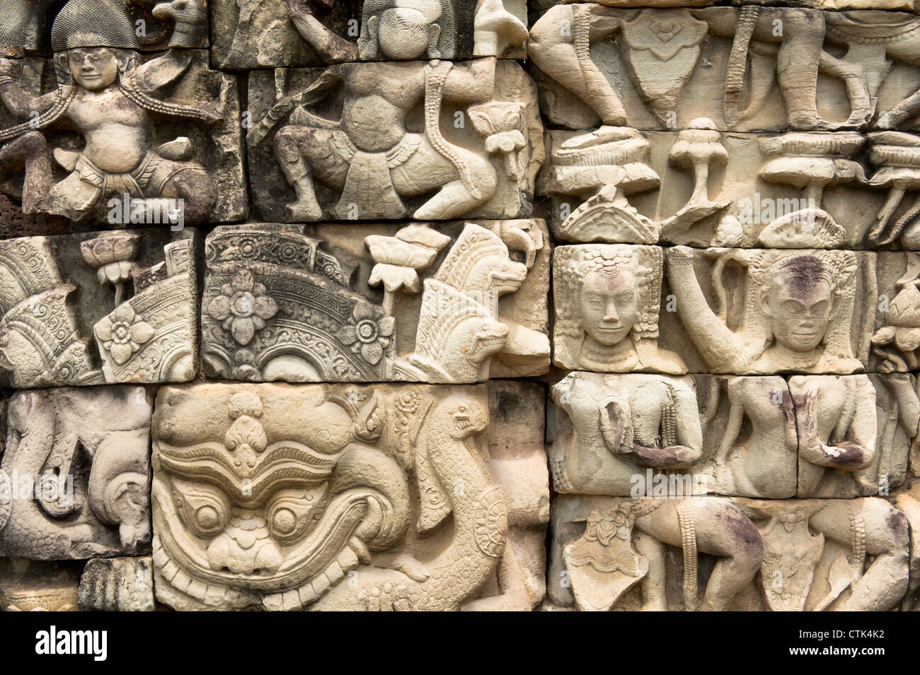 CAMBODIA, ANGKOR, Terrace of the Elephants. Assorted characters carving on Stone Wall. Stock Photo