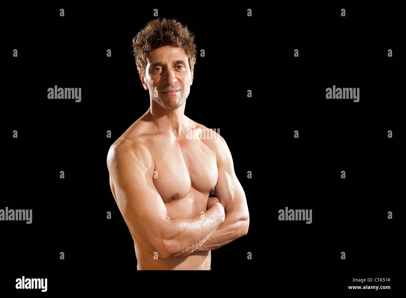 older mens physical health strong muscles 50 year old body fitness body  building sport on black background Stock Photo - Alamy