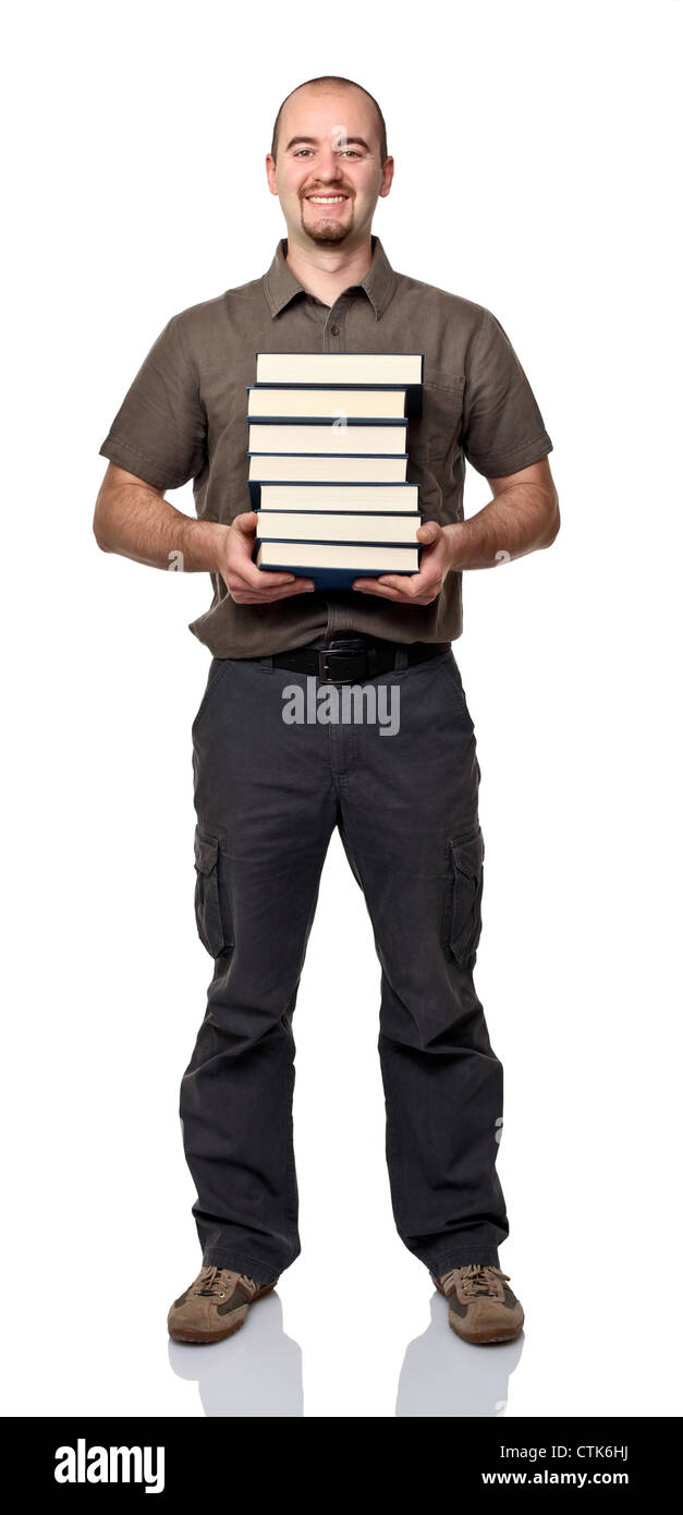 smiling standing man with pile of books on white background Stock Photo
