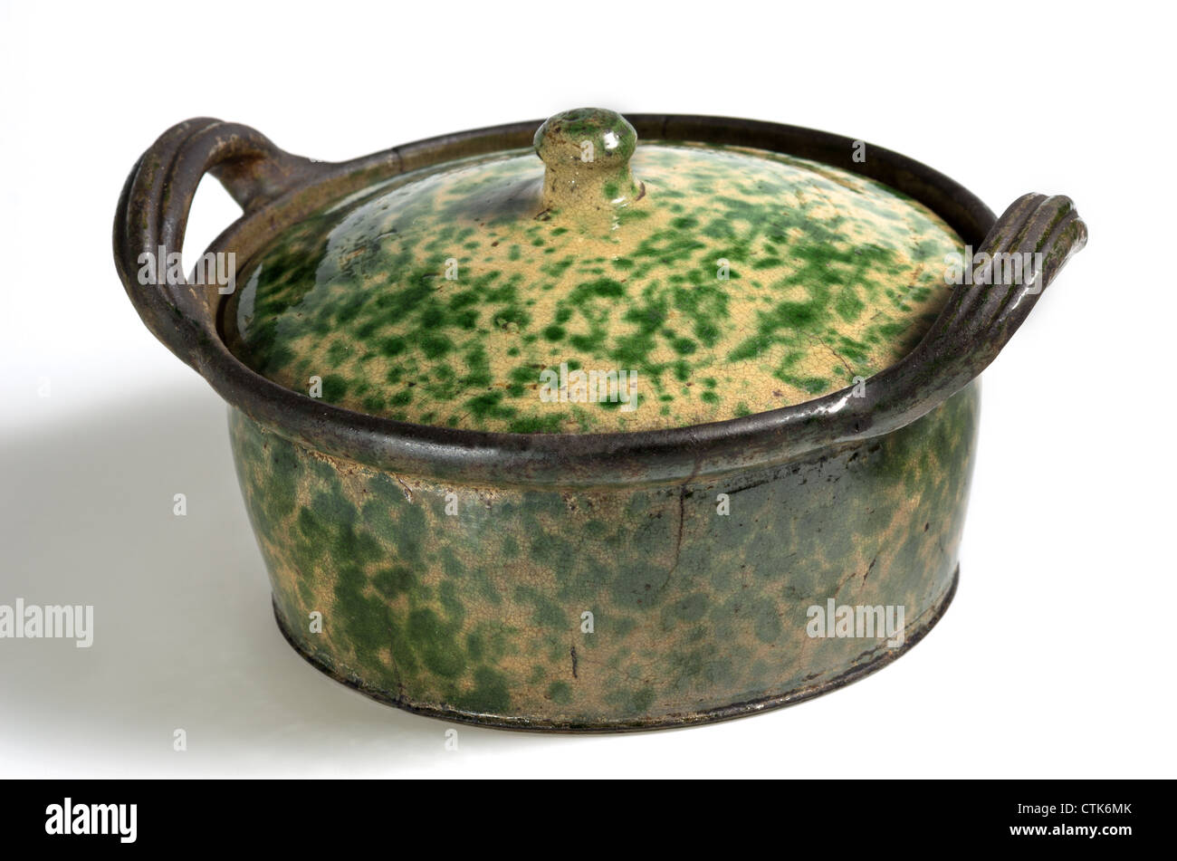 ceramic pot with lid glazed brown and green Stock Photo Alamy