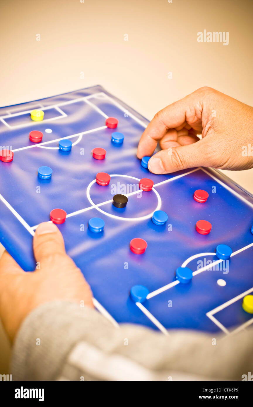 soccer trainer showing tactic on a magnetic board Stock Photo