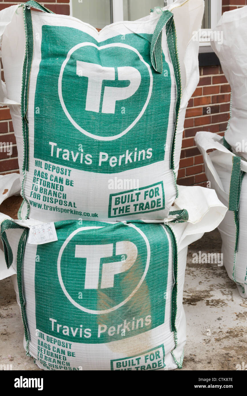 Travis Perkins builders merchant bulk building materials bags. Full bags possibly of sand. Stock Photo