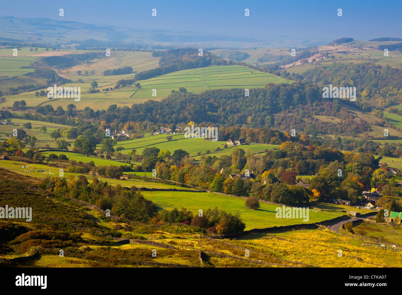 Looking west from Curbar Edge across Curbar village to Calver Peak in the Peak District National Park Derbyshire England UK Stock Photo