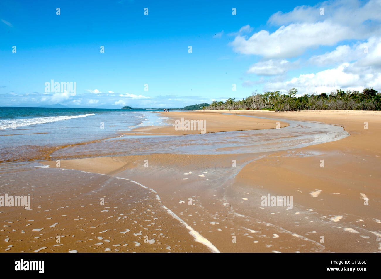 Low tide at a creek separating Wongaling Beach from South Mission Beach at Mission Beach, Cassowary Coast, Queensland Stock Photo