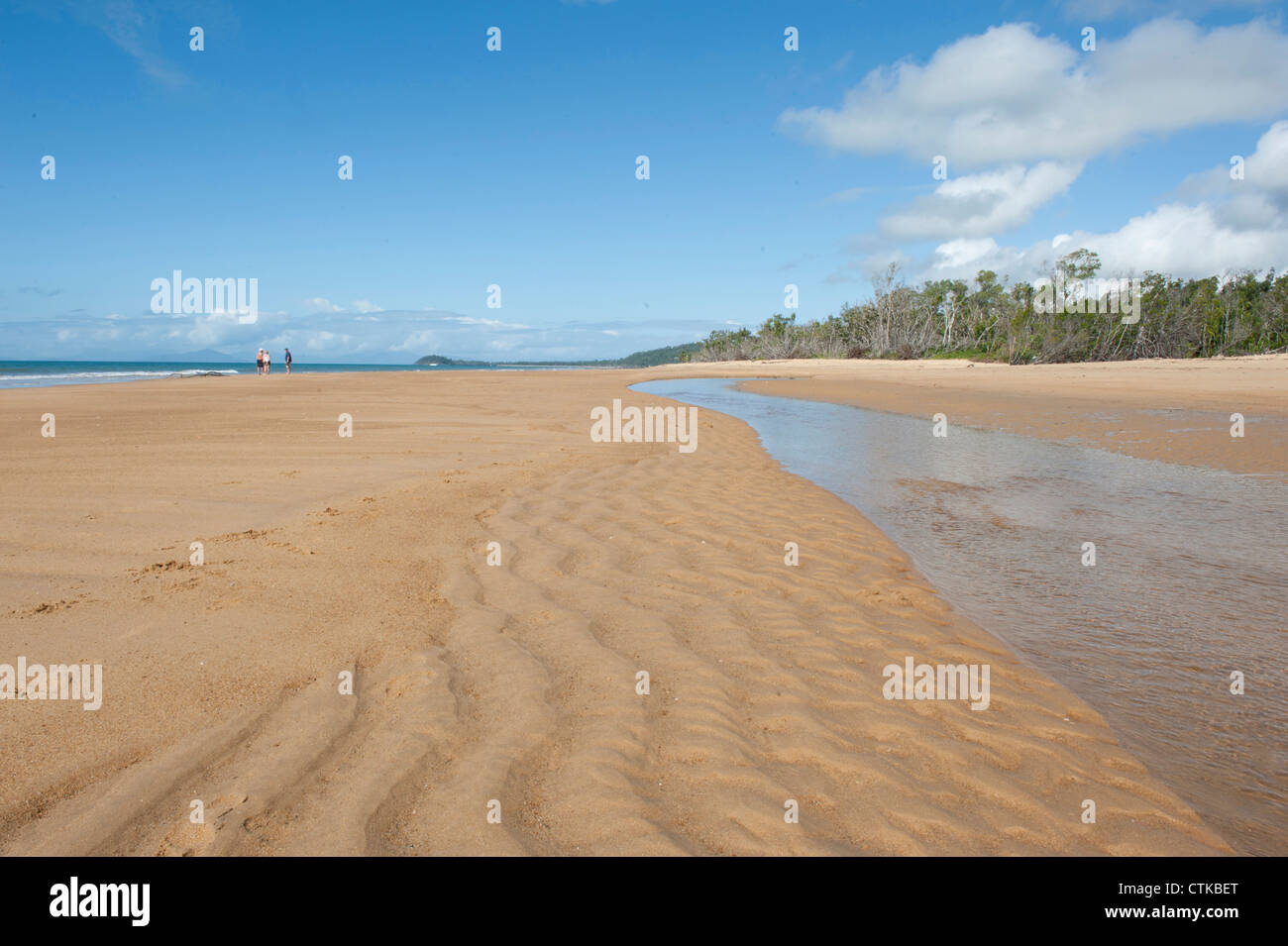 Low tide at a creek separating Wongaling Beach from South Mission Beach at Mission Beach, Cassowary Coast, Queensland Stock Photo