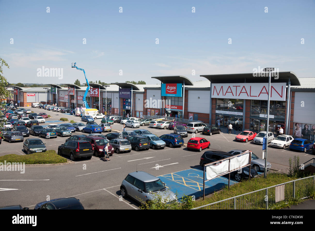 retail out of town park with various stores and car park Stock Photo