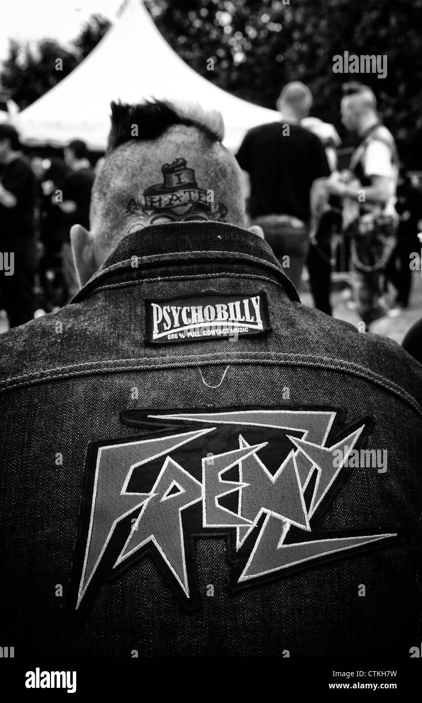 photo of psychobilly fan with patches on the back of his jacket Stock Photo