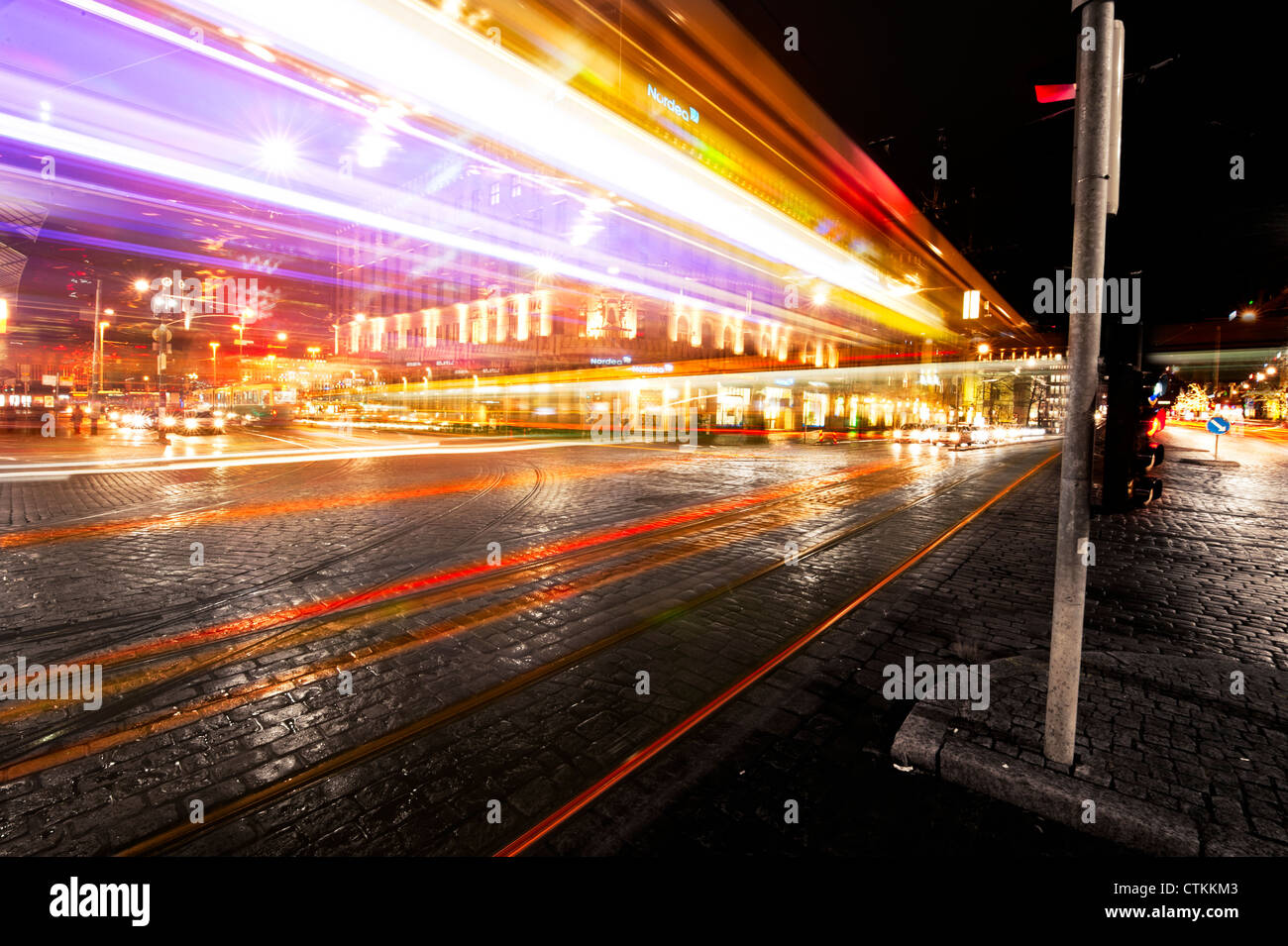 Light trails of cars passing on a busy crossing in Helsinki, Finland Stock Photo