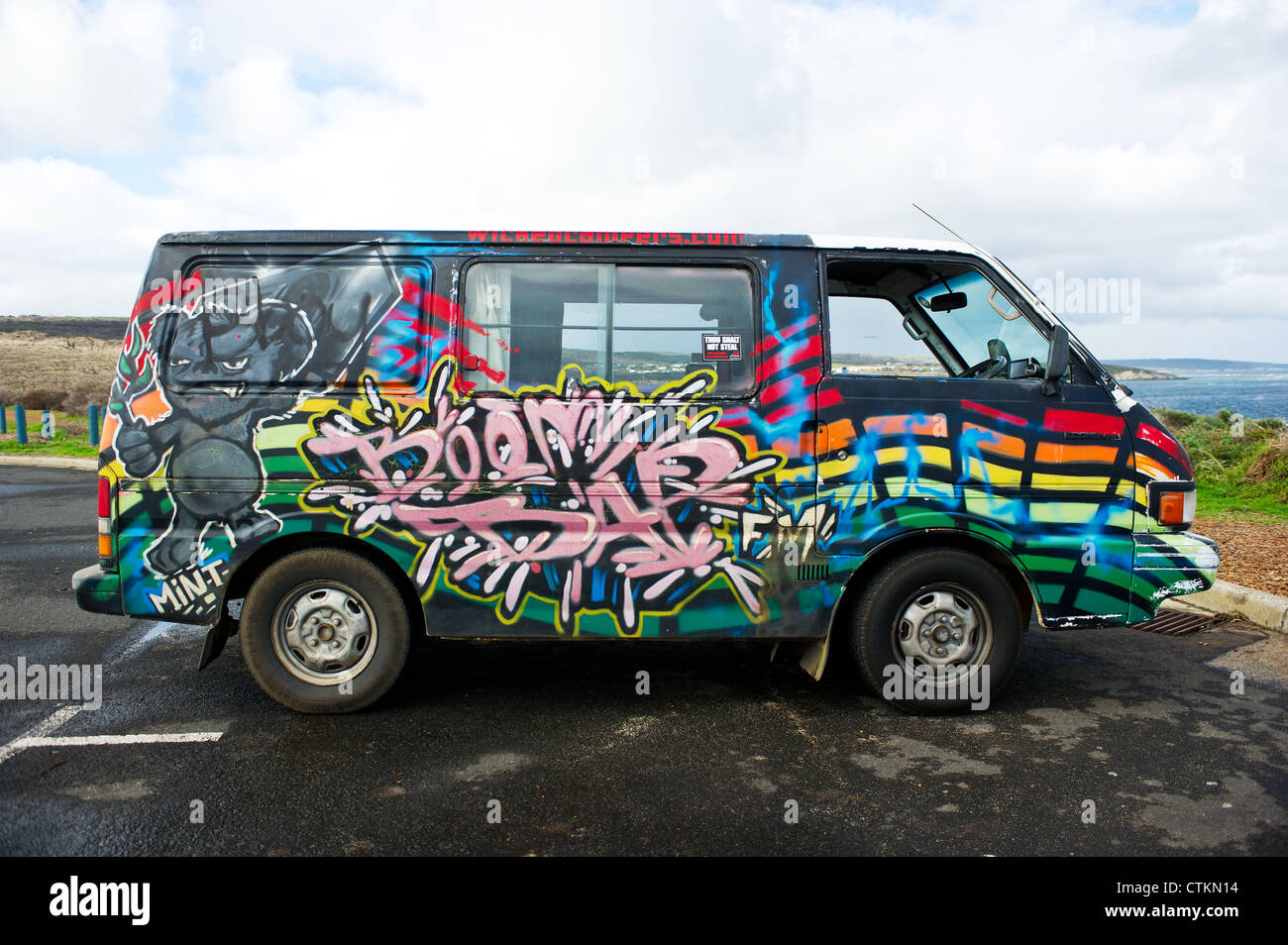 A Volkswagen Camper van covered in colourful designs Stock Photo
