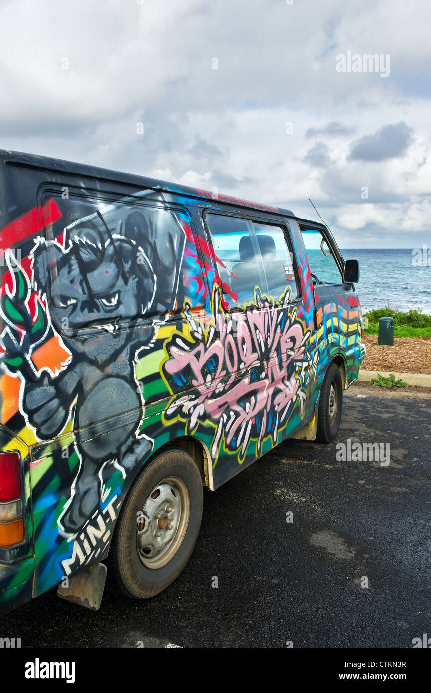 Colourful designs sprayed on the side of a Volkswagen Camper van. Stock Photo