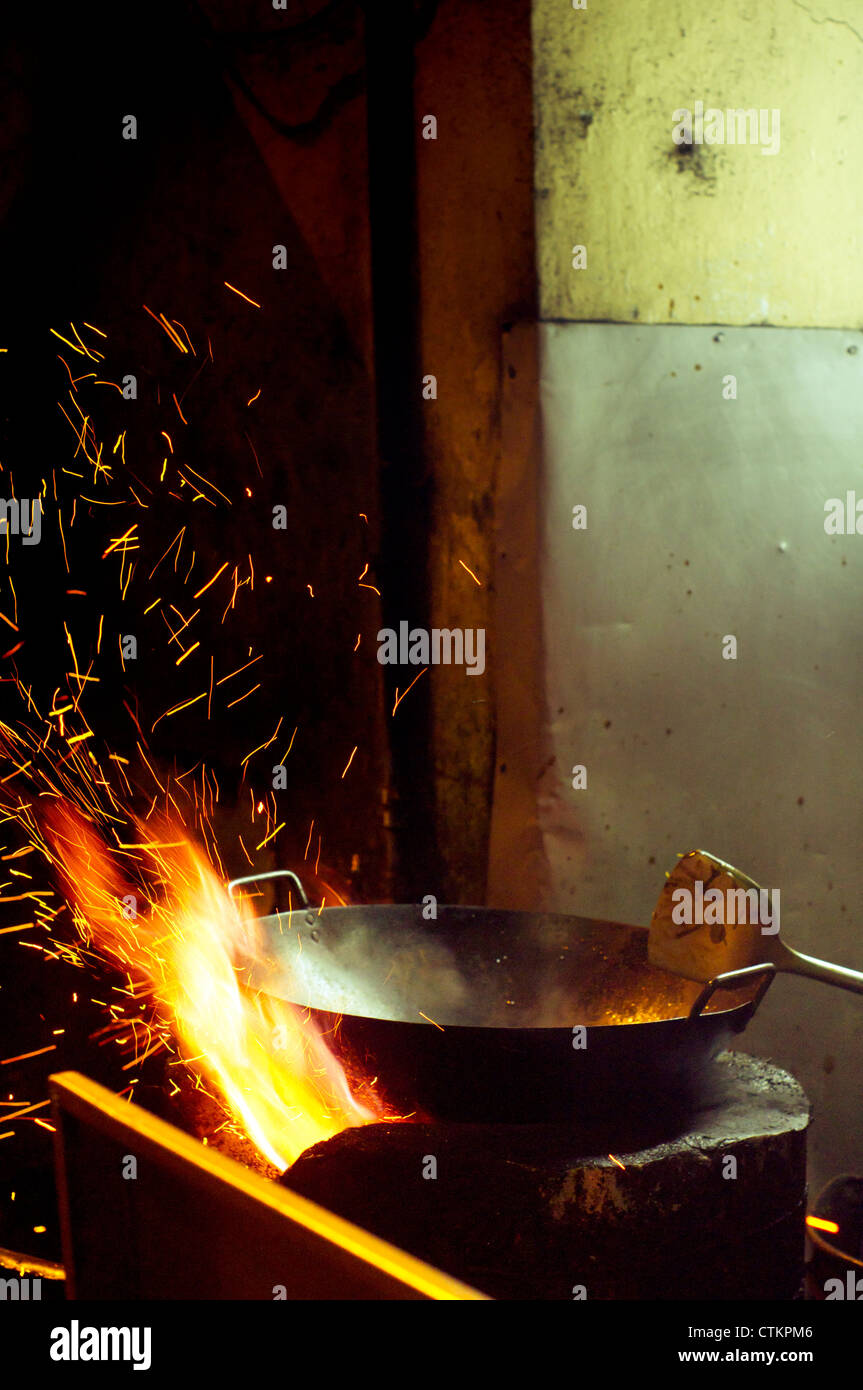 wok cooking in asian style, common scene at the street in asian