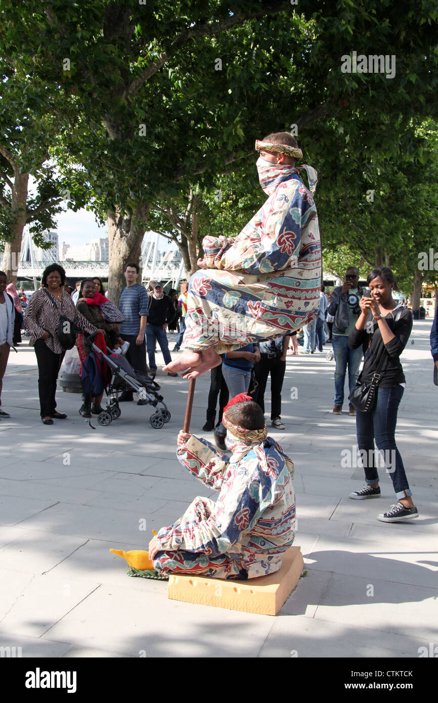 Street Performance at Jubilee Gardens on Londons South Bank Stock Photo