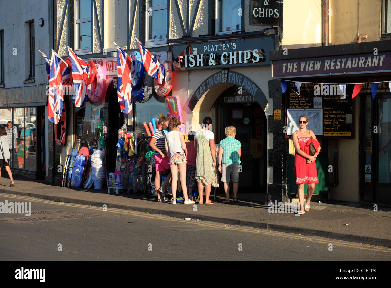 Queue outside a seaside fish and chip shop, Wells next the sea, Norfolk UK Stock Photo