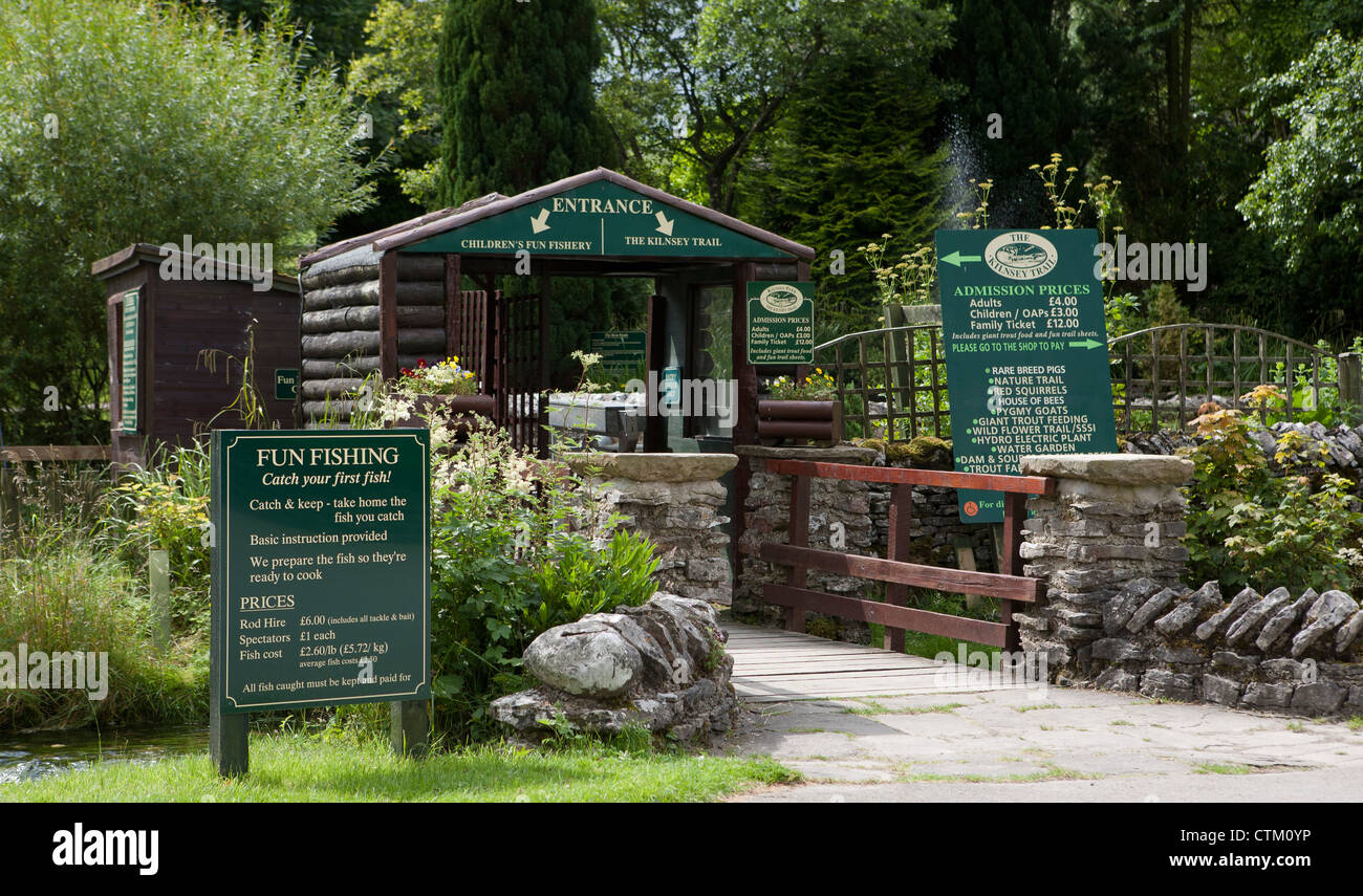 Kilnsey, Trout fishing lake and houses Kilnsey Crag Upper Wharfedale